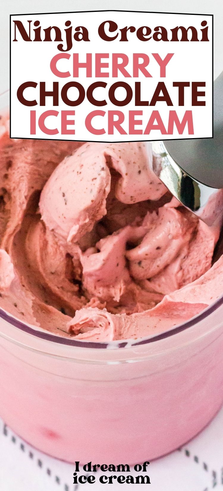 Ninja Creami pint of cherry chocolate ice cream with a scoop in it
