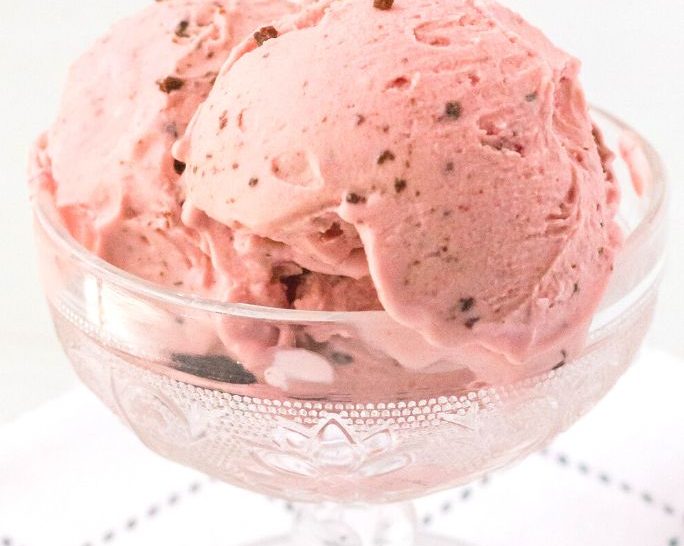 side view of a glass dessert cup serving scoops of Ninja Creami cherry chocolate ice cream, similar to a Black Forest ice cream.