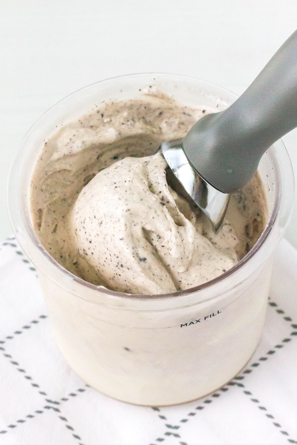 ninja creami pint container filled with cookies and cream ice cream