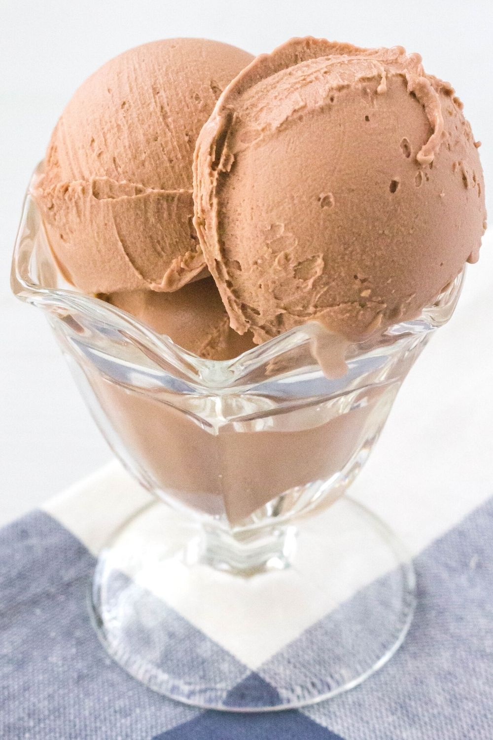 close-up side view of a dish serving scoops of Ninja Creami chocolate pudding ice cream.