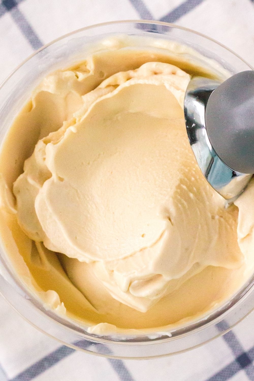 overhead view of a pint container filled with peanut butter ice cream that was made in the Ninja Creami ice cream machine.