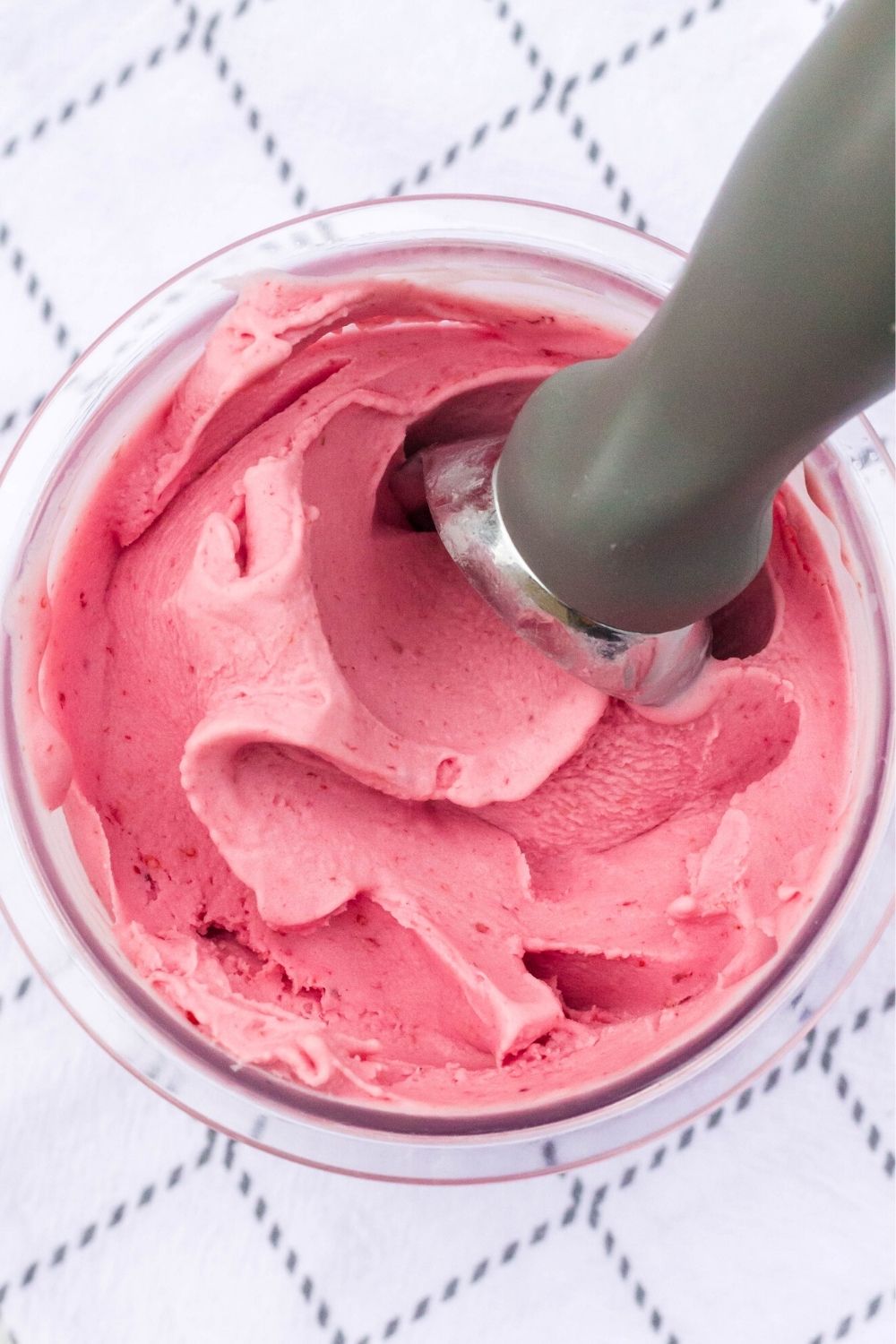 overhead view of ice cream made from cranberry sauce in a ninja creami pint container