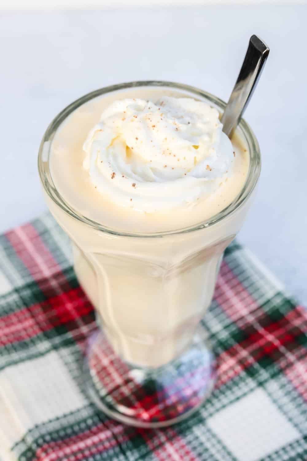 Ninja Slushie machine eggnog milkshake with a spoon in it.