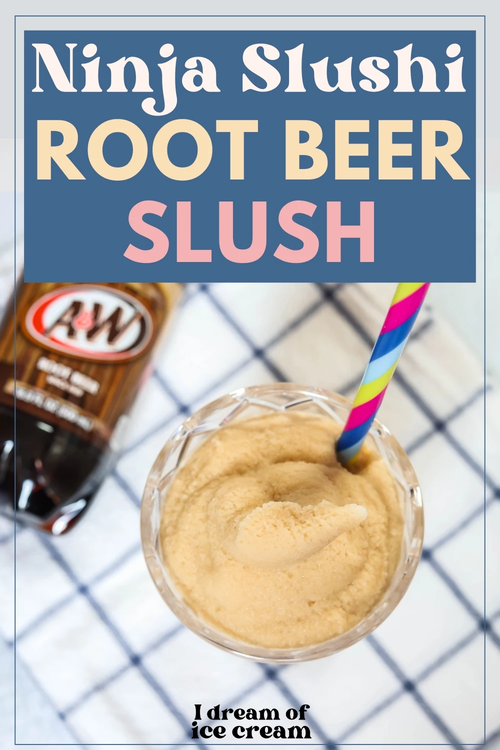 overhead view of a glass of Ninja Slushi root beer float slush, with a bottle of root beer next to it.