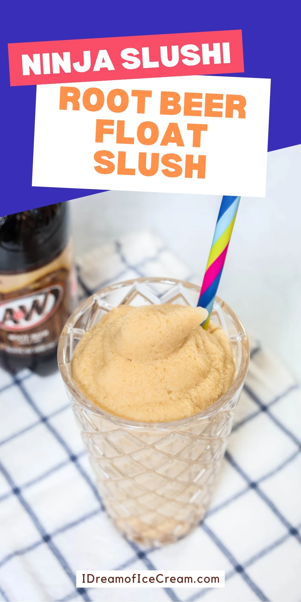 a glass of Ninja Slushi root beer slushie served with a straw. A bottle of root beer is in the background.