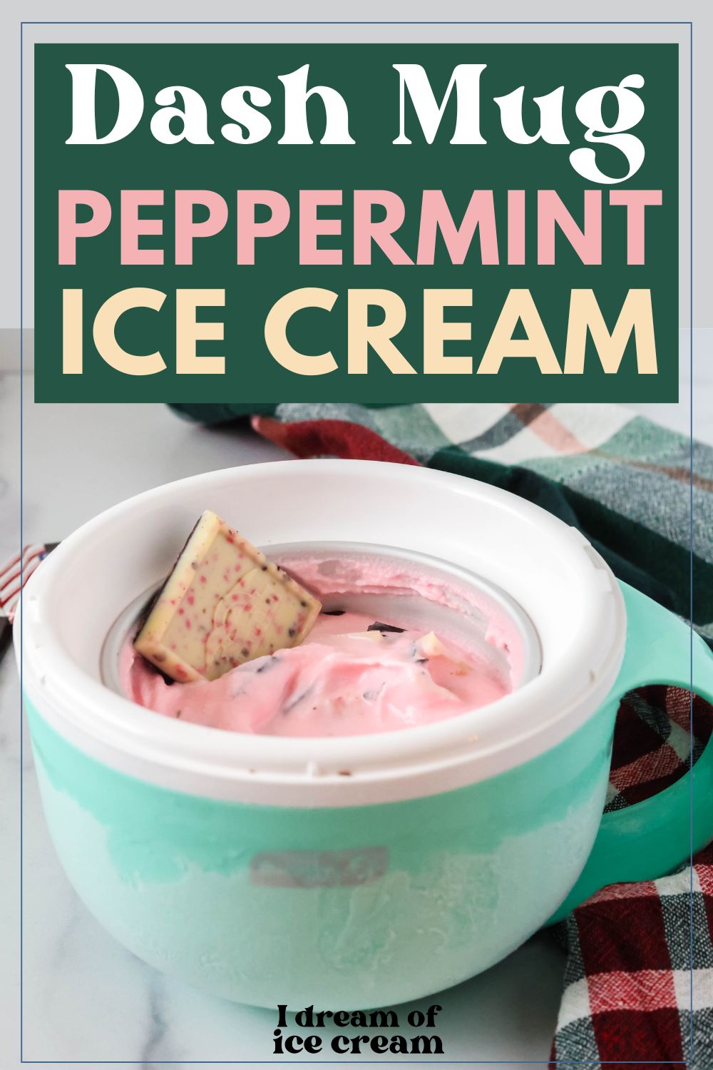 Pink peppermint bark ice cream served in a Dash Mug, garnished with a square of Ghirardelli peppermint bark candy.