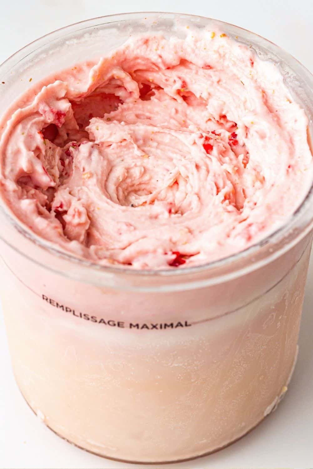 pint of Ninja Creami strawberry cheesecake ice cream made without pudding mix.
