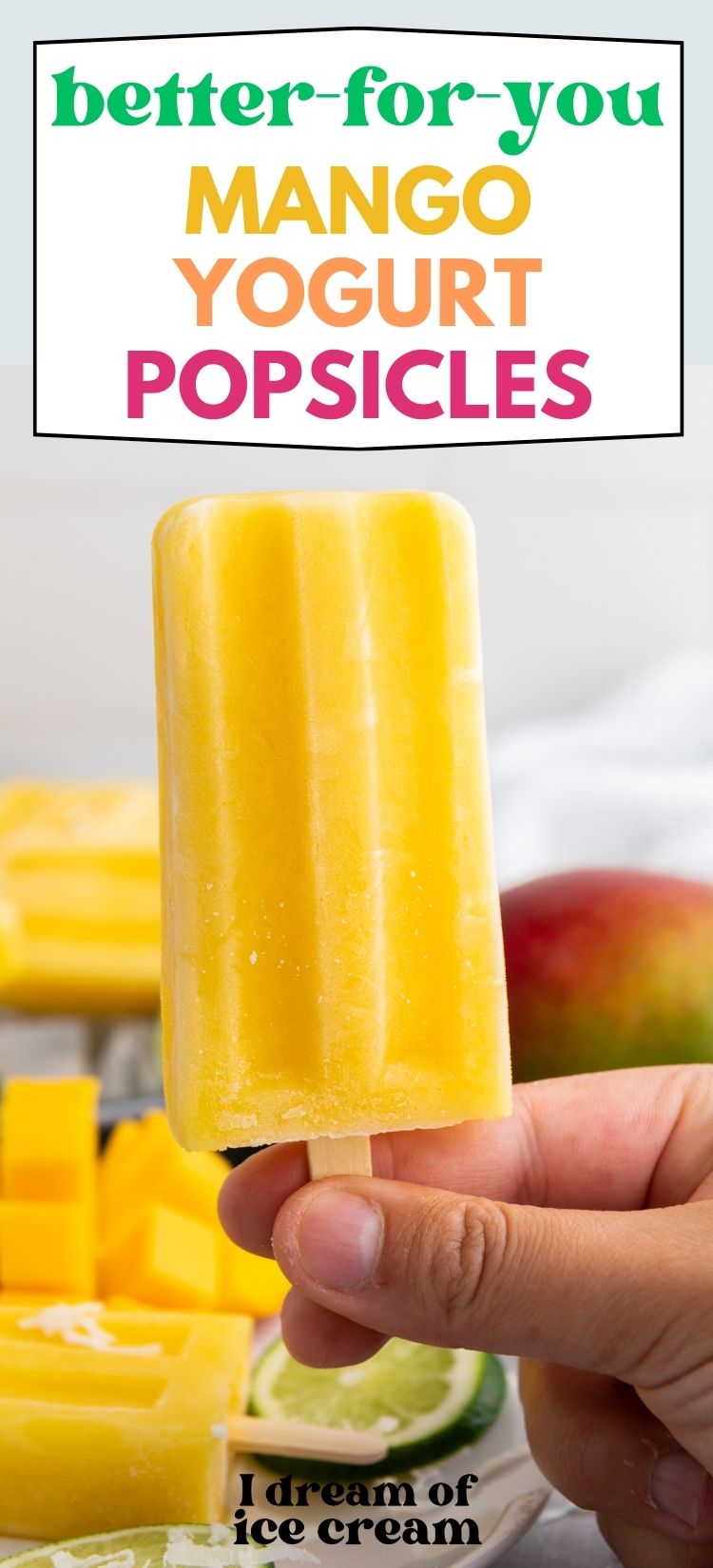 a woman's hand holds a mango yogurt popsicle.