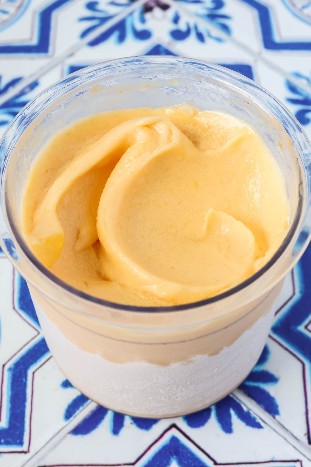Easy apricot sorbet in a Ninja Creami pint container.
